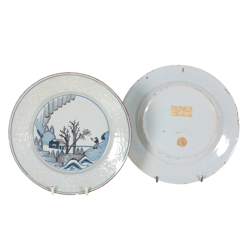 175 - A PAIR OF BRISTOL POLYCHROME DELFT PLATES c.1760, depicting a maiden with fan seated under a tree, e... 