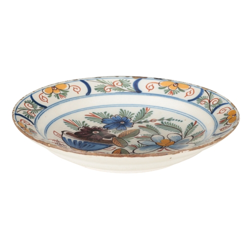 178 - A DUTCH DELFT CHARGER early 19th century, decorated in polychromes with flowers and foliage, 34cm wi... 