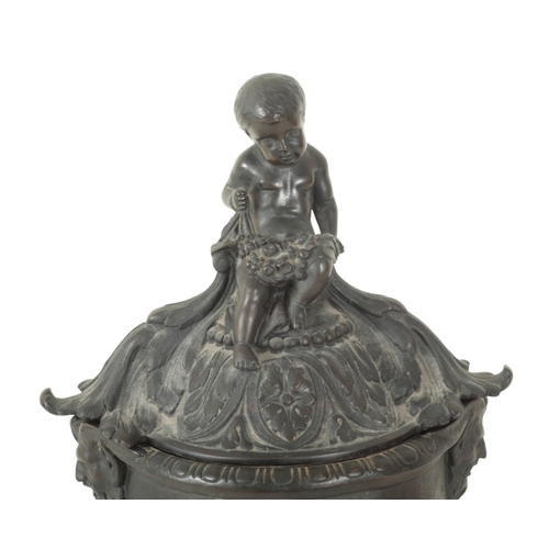 188 - AN EARLY 19TH CENTURY BRONZE URN AND COVER with seated putto finial, the body with twin satyr handle... 