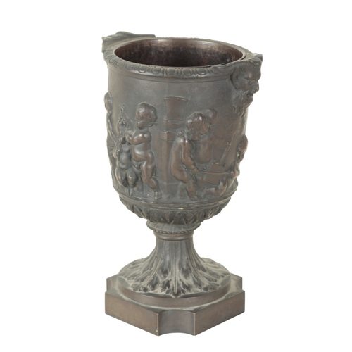 188 - AN EARLY 19TH CENTURY BRONZE URN AND COVER with seated putto finial, the body with twin satyr handle... 