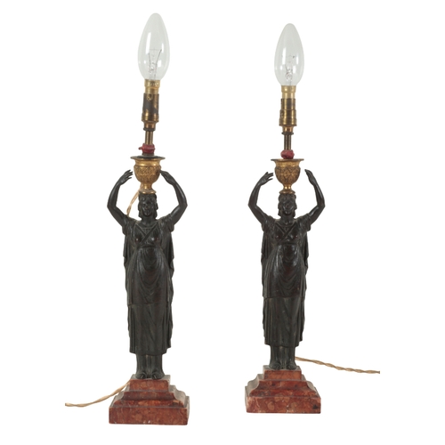 189 - A PAIR OF 19TH CENTURY DARK BROWN PATINATED BRONZE ELECTRIC TABLE LAMPS modelled as standing Classic... 