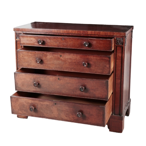 268 - AN UNUSUAL REGENCY MAHOGANY 'PLUM-PUDDING' CHEST OF DRAWERS the panelled top with feathered bandings... 