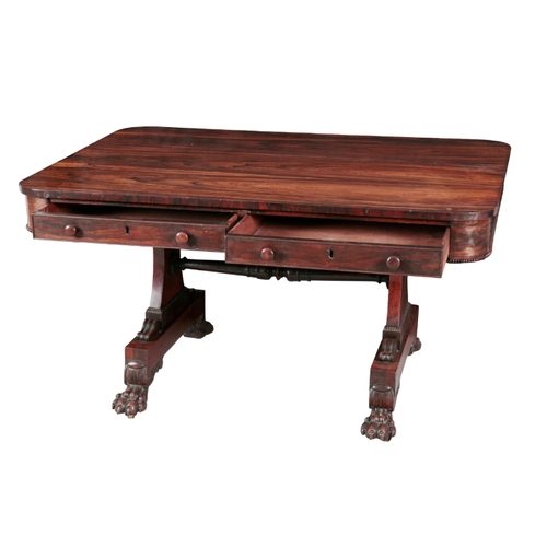 289 - A REGENCY ROSEWOOD LIBRARY TABLE early 19th century, two frieze drawers to one side and false drawer... 