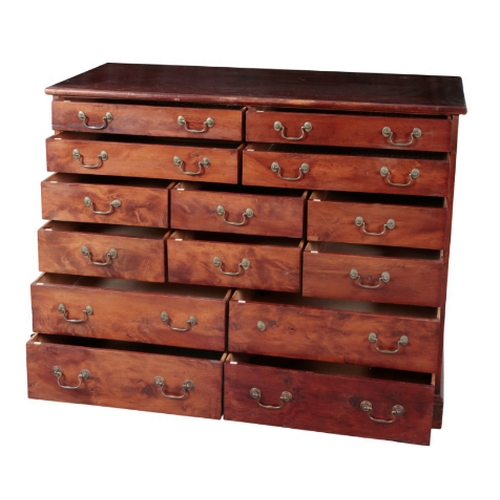 297 - AN UNUSUAL BANK OF DRAWERS 20th century, with an arrangement of fourteen  short drawers, on a pedest... 