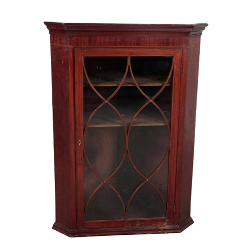 303 - A NEAR PAIR OF GEORGE III MAHOGANY CORNER CUPBOARDS both with moulded pediments over glazed single d... 