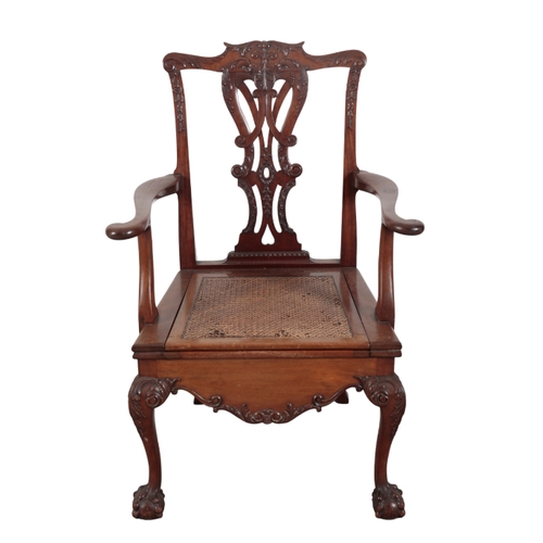 311 - A GEORGE II STYLE COMMODE CHAIR IN THE MANNER OF THOMAS CHIPPENDALE with carved and pierced back spl... 