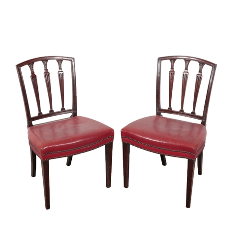 315 - A SET OF SIX MAHOGANY DINING CHAIRS OF SHERATON STYLE with arched crest rails, triple carved and ree... 