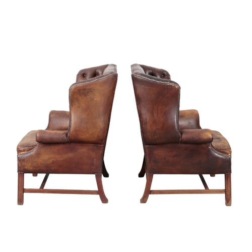 331 - A PAIR OF GEORGE III STYLE MAHOGANY WING CHAIRS 20th century, upholstered in buttoned dark brown lea... 