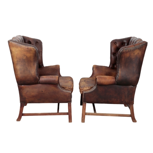 331 - A PAIR OF GEORGE III STYLE MAHOGANY WING CHAIRS 20th century, upholstered in buttoned dark brown lea... 