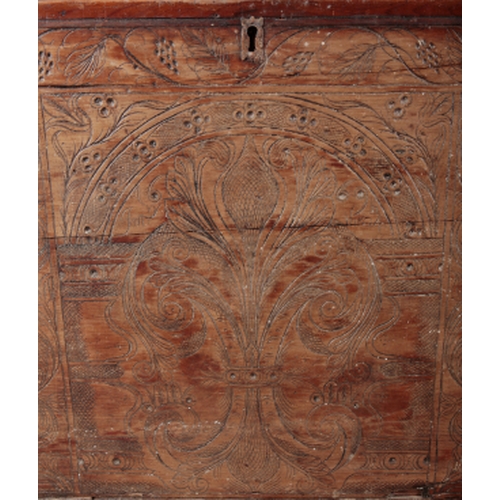 336 - A 17TH CENTURY PINE DOWRY CHEST engraved to front with twin lions, scrolled leaves and dated January... 