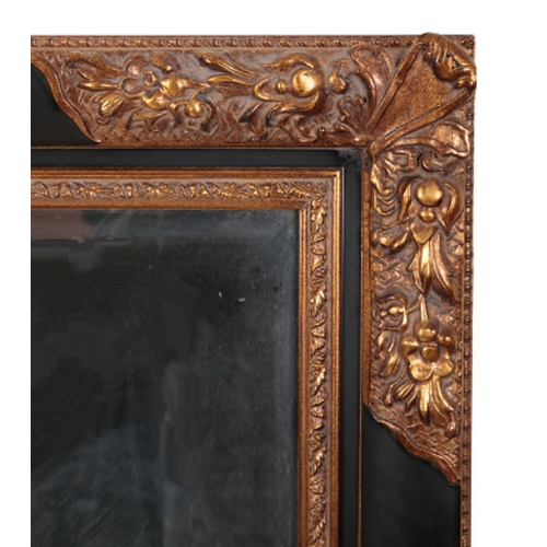 351 - AN EBONISED AND PARCEL GILT RECTANGULAR MIRROR OF 18TH CENTURY DESIGN with bevelled mirror plate, 14... 