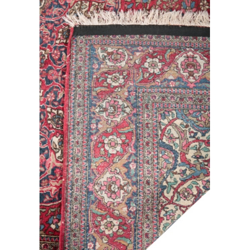 378 - AN ANTIQUE KASHAN RUG woven in blue, off white and other colours with oval double headed medallion, ... 