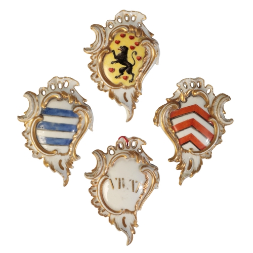 64 - A SET OF FOUR MEISSEN ROCOCO ARMORIAL PLAQUES circa 1750, with the arms of Eisenberg, Ravensberg, La... 