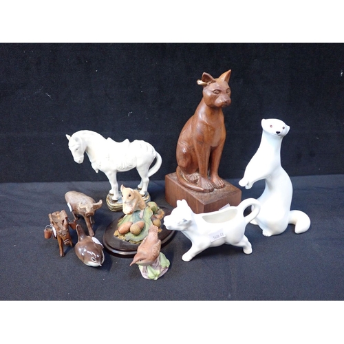 50 - A SOVIET ERA RUSSIAN OTTER MODEL with a collection of animal and bird models in ceramic and wood, in... 