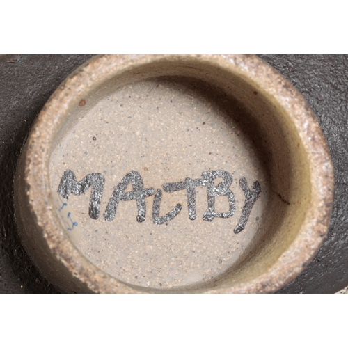 679 - *JOHN MALTBY (1936-2020): A HAND-BUILT STONEWARE FOOTED VESSEL decorated with stylised crosses, dots... 