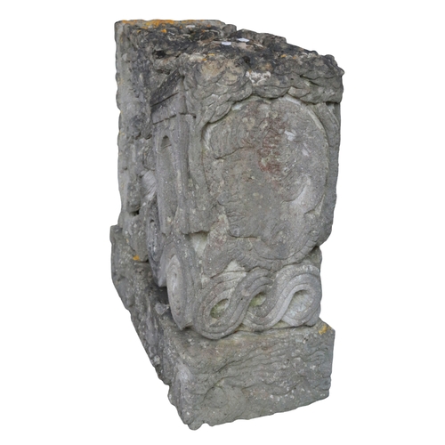 516 - *ANTHONY LYSYCIA (B. 1959) a rectangular stone carving decorated with figures and faces, foliage and... 