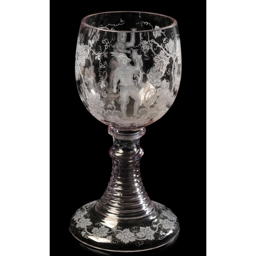 532 - A BOHEMIAN HATCH DECORATED GOBLET c.1920s, decorated with figures among fruiting vines, 21cm high