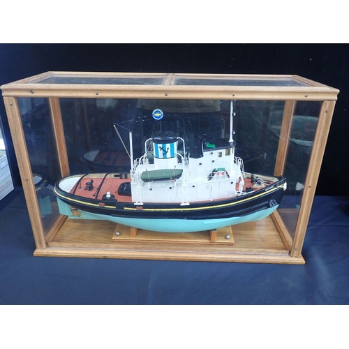 24 - A CASED MODEL OF A TUG