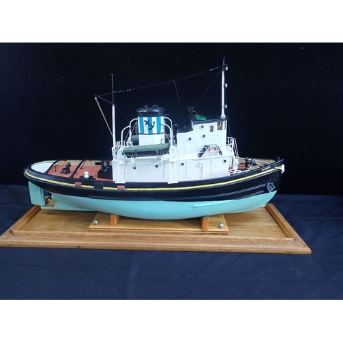 24 - A CASED MODEL OF A TUG