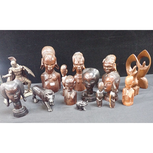 34 - A COLLECTION OF AFRICAN SCULPTURES hardwood, animals, figures and busts, with a resin figure of Hect... 