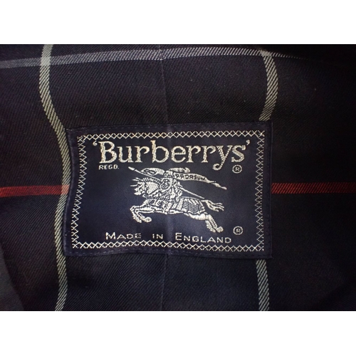 187 - A VINTAGE LADIES BURBERY TRENCH COAT navy, actual measuremenets underarm, 105cms