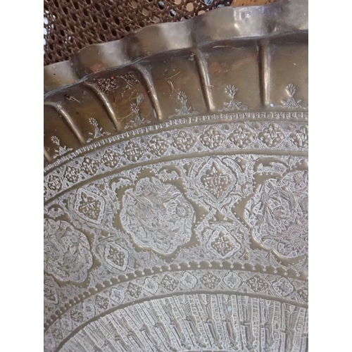 278 - A LARGE PERSIAN STYLE DECORATIVE BRASS TRAY 95cms dia, with another wihite metal decorative tray