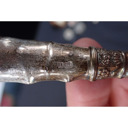 363 - A SILVER HANDLED BREAD KNIFE with a silver handled button hook and small spon together with a quanti... 