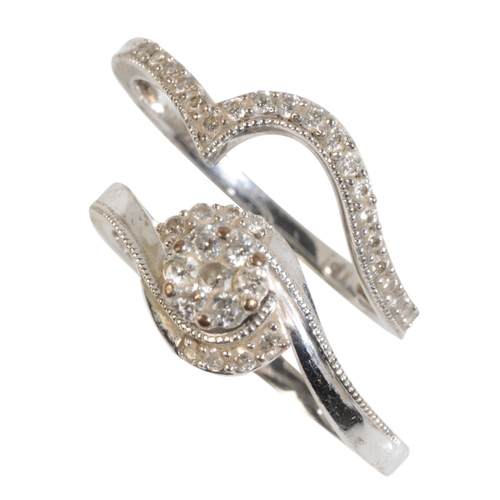 396 - A DIAMOND ENGAGMENT RING together with a matching shaped wedding ring, both rings set with diamonds,... 