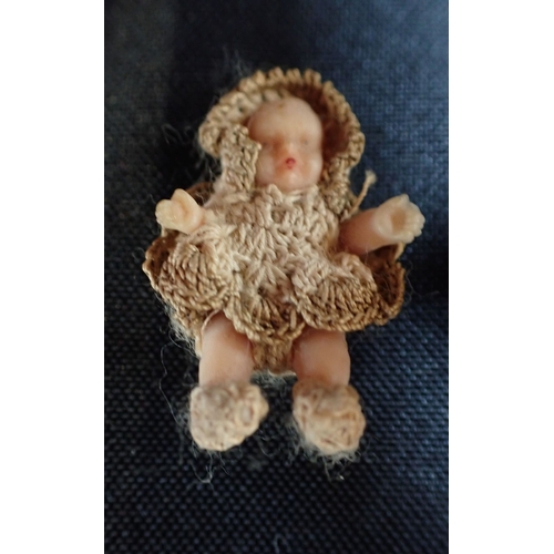 422 - A EDWARDIAN BISQUE DOLL together with a small baby doll with crochet clothing