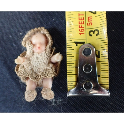 422 - A EDWARDIAN BISQUE DOLL together with a small baby doll with crochet clothing