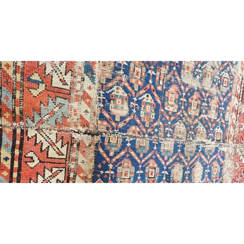 568 - AN ANTIQUE SHIRVAN RUNNER woven in colours with endless boteh repeat on a dark blue ground within wi... 