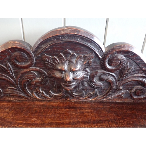 586 - A VICTORIAN CARVED OAK HALL TABLE carved with grotesques, with frieze drawer 108cm wide