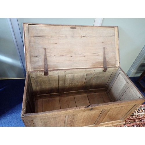 631 - AN OLD LIGHT OAK AND PINE COFFER with oak panelled front, sides and back, pine lid and plinth 111 x ... 