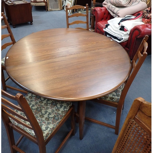 640 - AN ERCOL NARROW DROP-LEAF DINING TABLE with oval elm top 128cm wide, with four Ercol ladderback chai... 