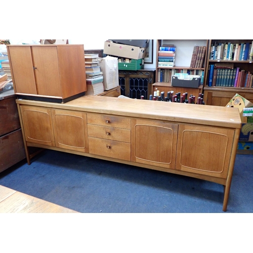 654 - A MID-CENTURY MODERN TEAK DINING SUITE, THE TABLE STAMPED 'NATHAN FURNITURE' comprising sideboard 21... 