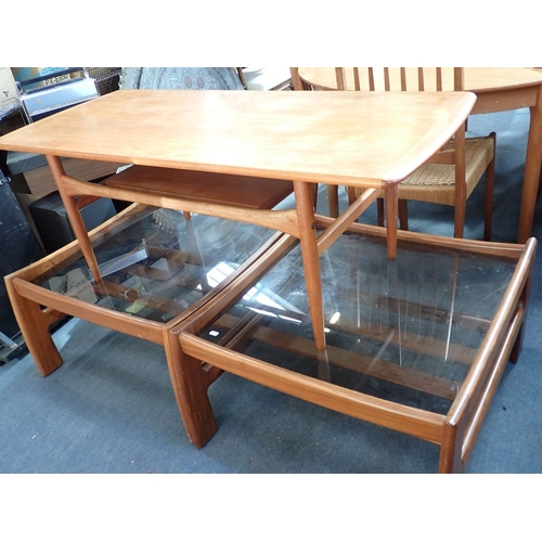 671 - A PAIR OF MID-CENTURY MODERN COFFEE TABLES with smoked glass tops and slatted under tier, each 72 x ... 