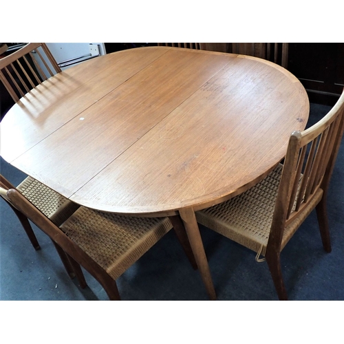 676 - A MID-CENTURY MODERN TEAK DINING TABLE AND SIX CHAIRS the 61cm circular table extending with two lea... 