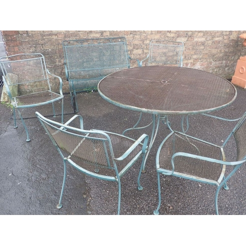 1 - A FRENCH STYLE METAL CIRCULAR GARDEN TABLE AND FOUR ARMCHAIRS the table 120cm diam, the chairs 89cm ... 