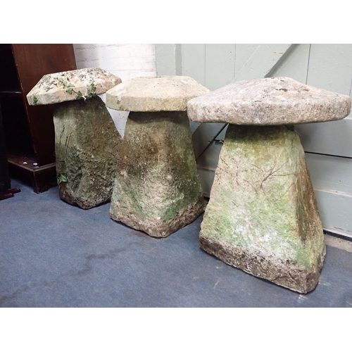 13 - THREE SIMILAR STADDLE STONES of typical form, 64cm, 66cm, and 69cm high (caution; VERY HEAVY)