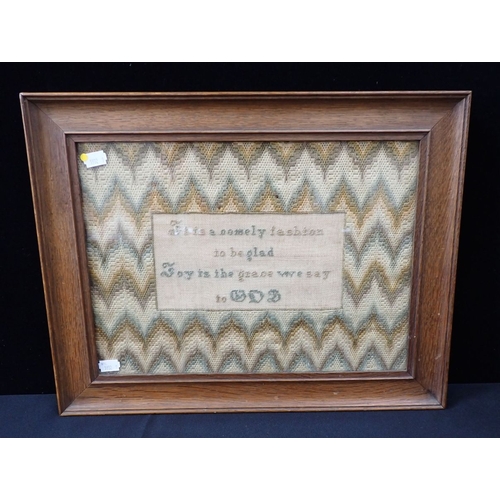 20 - A VICTORIAN MOTTO/SAMPLER with flamestitch border, 'It is a comely fashion to be glad....' in an oak... 