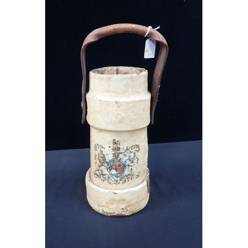 22 - A PAINTED CANVAS CORDITE OR SHOT CARRIER with transfer armorial and leather handle 33cm high (a/f)