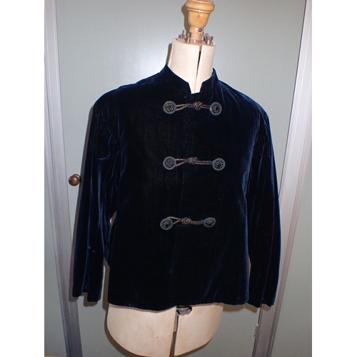 23 - A VICTORIAN LADIES' BLUE VELVET JACKET with quilted lining and silk covered buttons with 'jet' glass... 