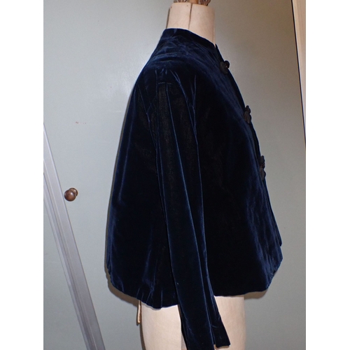 23 - A VICTORIAN LADIES' BLUE VELVET JACKET with quilted lining and silk covered buttons with 'jet' glass... 