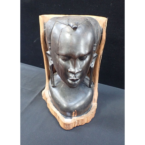 30 - AN AFRICAN CARVED WOODEN HEAD the back and base retaining natural bark finish 38cm high