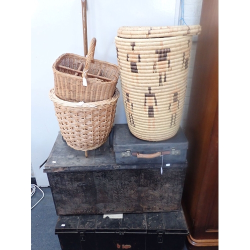 36 - A WICKER BASKET ON WHEELS, A LAUNDRY BASKET two Japanned trunks, a leather case and a bottle basket ... 