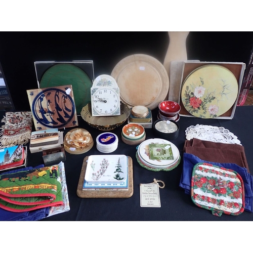 44 - A TURNED WOODEN BREAD BOARD, COASTERS a blue and white tile and sundries