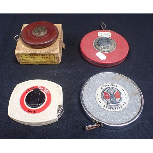 50 - FOUR VINTAGE TAPE MEASURES