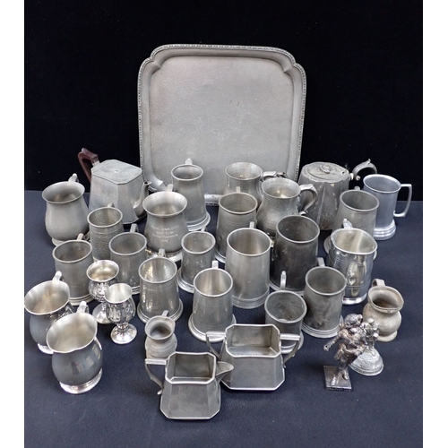 110 - A QUANTITY OF PEWTER WARE including a planished 'Craftsman Pewter' tea set, 20th century beer mugs a... 