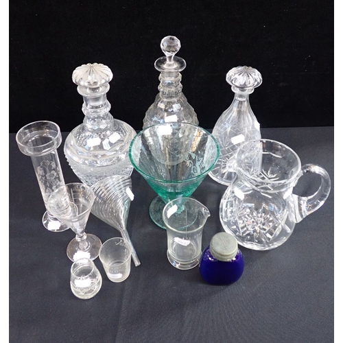 67 - A COLLECTION OF GLASSWARE including decanters, measuring glasses and a funnel