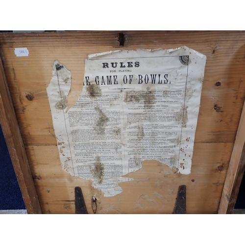 173 - A COLLECTION OF ANTIQUE BOWLING WOODS in an old pine carrying case, with the remains of a label with... 